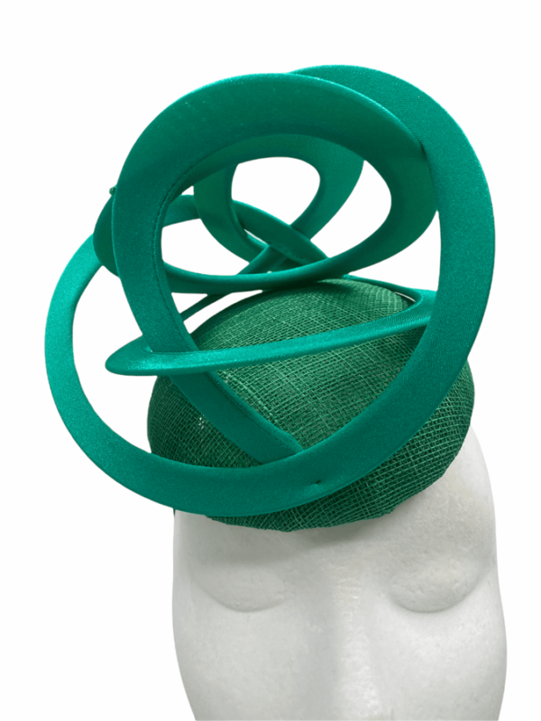 Green headpiece with green swirl detail.