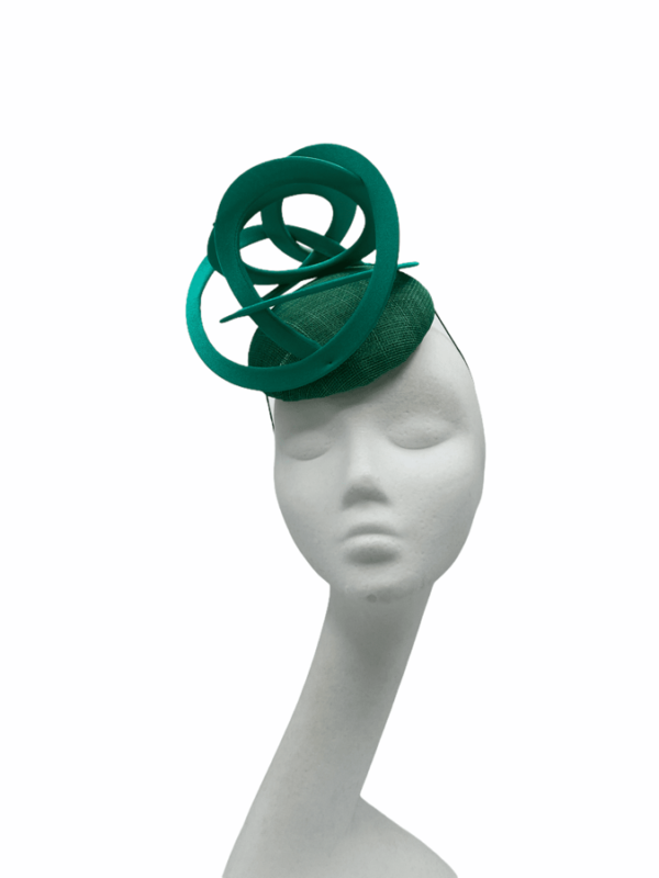 Green headpiece with green swirl detail.