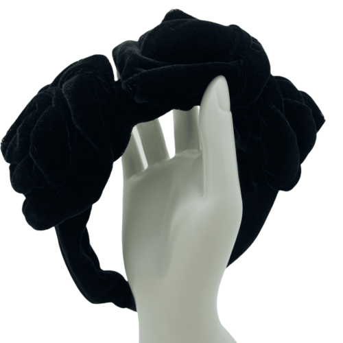 Black velvet headband with 3 beautiful flower twirls.