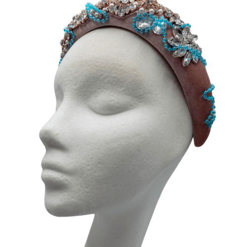 Pink millinery made headband crown with clear stone and gold embellishment and aqua blue beading.