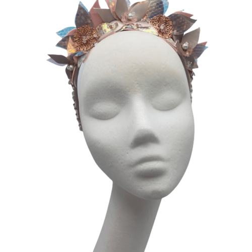 Baby pink flower headband with an array of pink iridescent/cream leaves and flowers.
