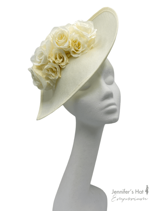 Large cream teardrop shaped headpiece on a headband with stunning cream flowers to compliment.