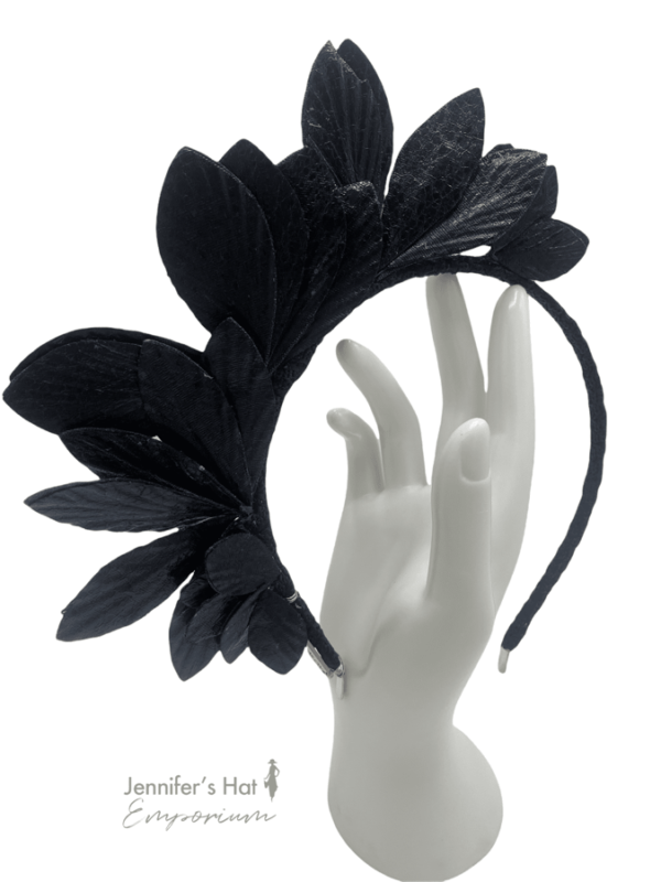 Black leaf crown, crown sits from centre down one side of the head.