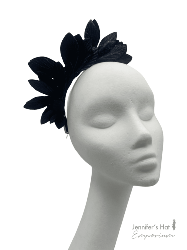Black leaf crown, crown sits from centre down one side of the head.
