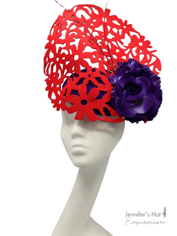Red laser cut headpiece with cadbury purple base, perfect hat for colour clashing.