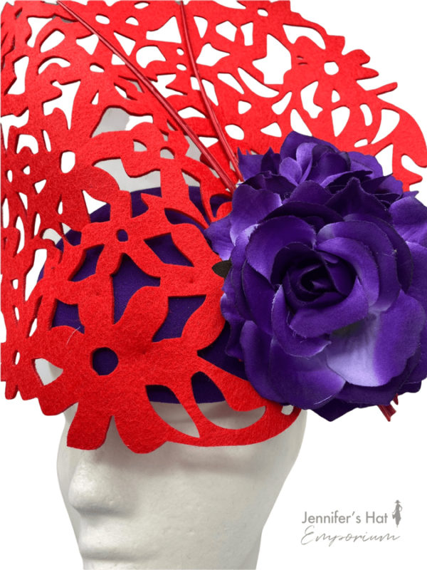 Red laser cut headpiece with cadbury purple base, perfect hat for colour clashing.