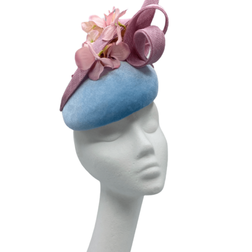 Blue velvet headpiece with baby pink flower detail and gold swirl.