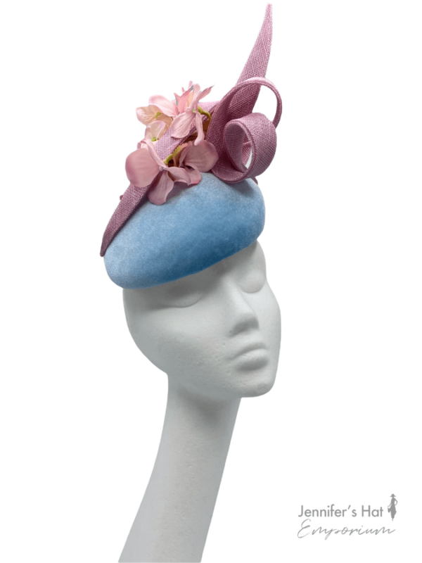 Blue velvet headpiece with baby pink flower detail and gold swirl.