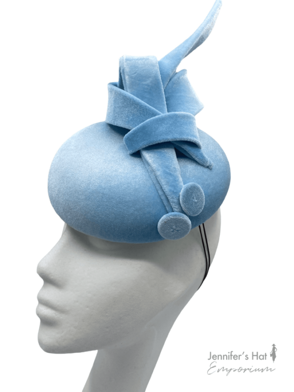 Baby blue velvet headpiece with beautiful swirl detail.