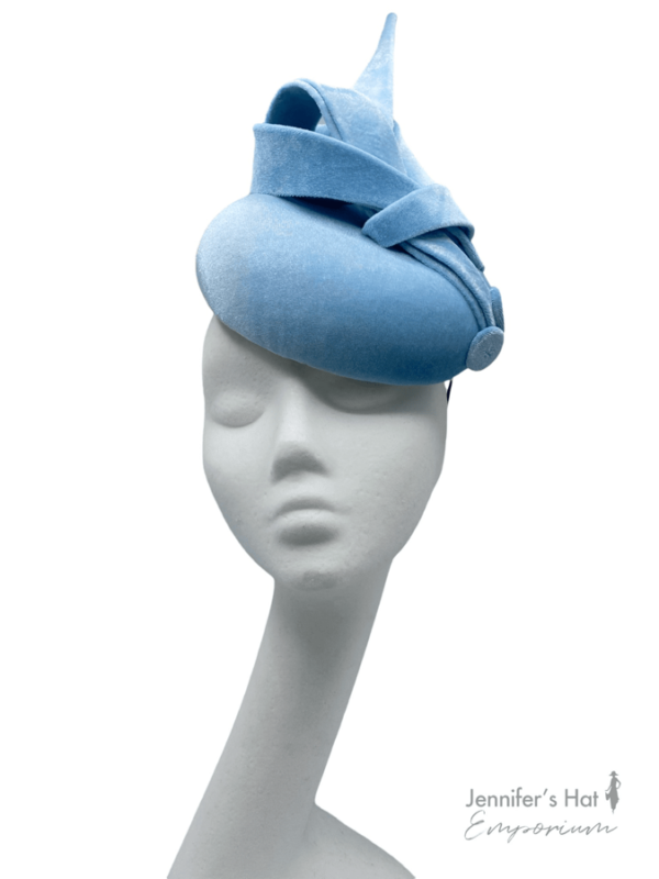 Baby blue velvet headpiece with beautiful swirl detail.
