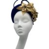 Blue bandeau crown with gold flower detail.