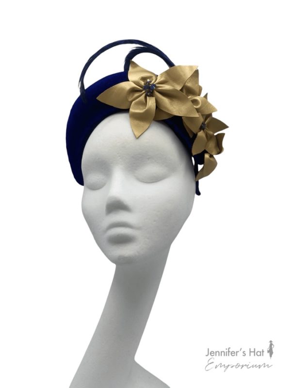 Blue bandeau crown with gold flower detail.