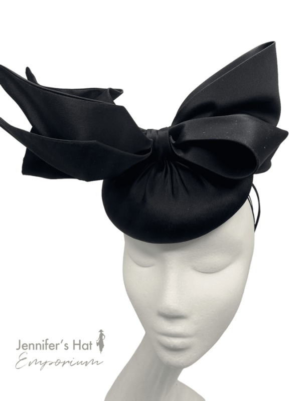 Stunning black satin headpiece with with the most beautiful bow detail on a headband and elastic for extra security.