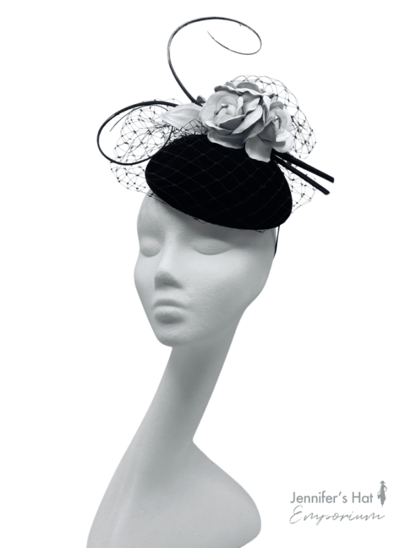 Black velvet base headpiece with white leather flowers.