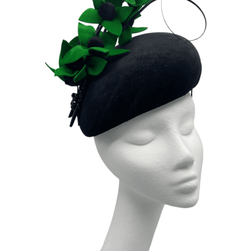 Large black velvet teardrop with handmade green felt flower detail. Stunning headpiece.