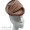 Nude/beige headpiece with interwoven fan detail.