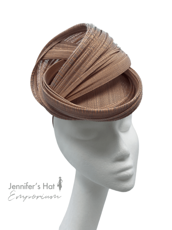 Nude/beige headpiece with interwoven fan detail.
