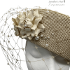 Beige coloured headpiece with pearl encrusted full face veiling.