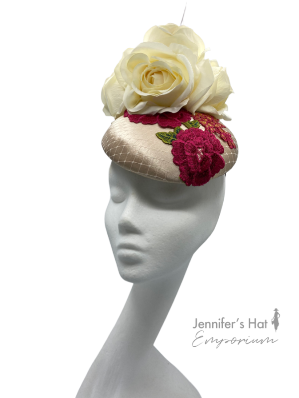 Cream headpiece with ivory flowers and a beautiful flower motif in pink and green.