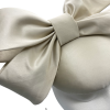 Stunning cream satin side bow headpiece.