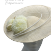 Large ivory side saucer headpiece with pom pom detail and matching coloured quill to finish.