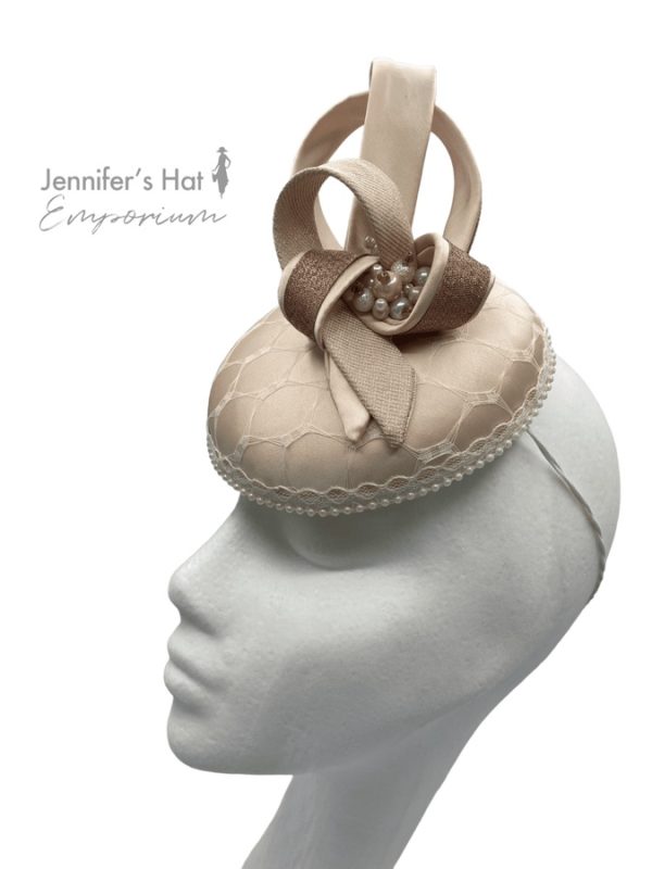 Cream headpiece with blush swirl detail, finished with some beading.