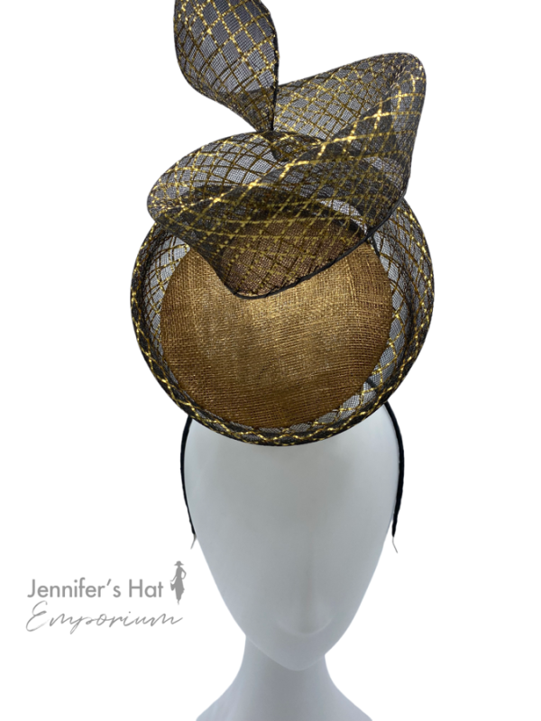 Stunning gold percher headpiece with black detail.