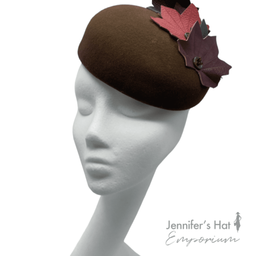 Chocolate brown felt headpiece with stunning autumnal coloured leather leaves detail.