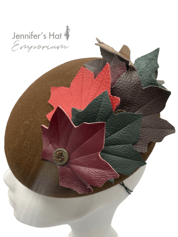 Chocolate brown felt headpiece with stunning autumnal coloured leather leaves detail.