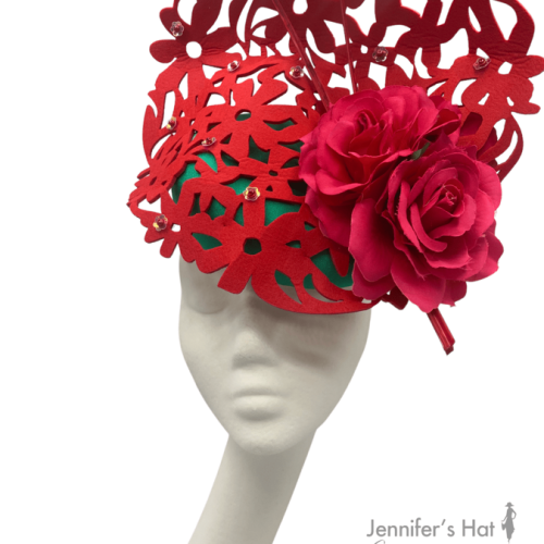 Red laser cut headpiece with emerald green base, perfect hat for colour clashing.
