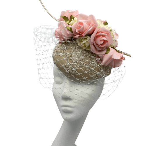 Gold satin pace with lace detail, finished with cream veiling with pink flowers on top.