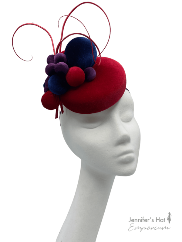 Small smartie sized headpiece with navy and purple ball detail.