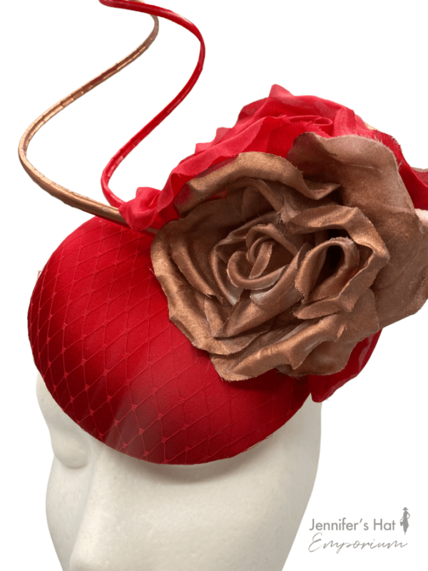 Red small satin headpiece with red and rose gold flowers and red quill detail.