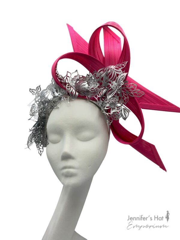 Pink structured headpiece with silver laser cut design detail.