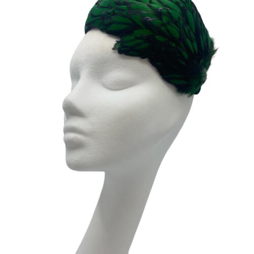 Stunning emerald green and black feather crown with little jewel detail to finish.