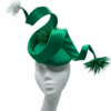 Stunning emerald green satin swirl detail showstopper headpiece.