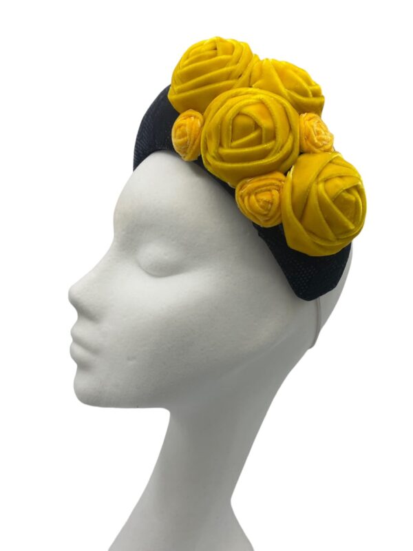 Stunning black bandeau crown with stunning yellow velvet flower detail.