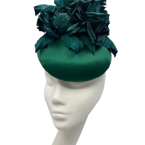 Stunning forest green satin headpiece with handmade flowers.