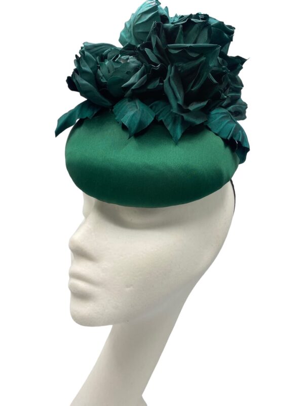 Stunning forest green satin headpiece with handmade flowers.