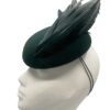 Beautiful forest green felt base headpiece with a gorgeous array of structured feather detail.