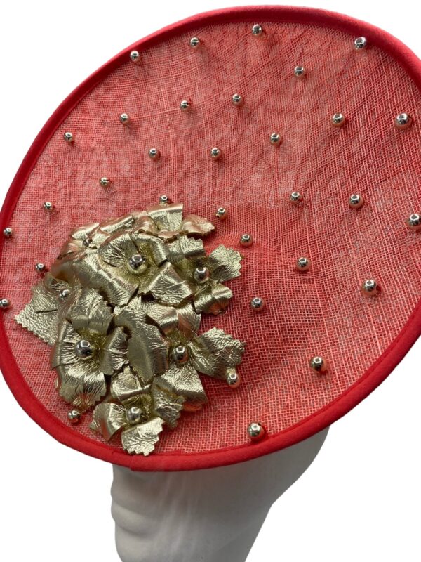 Deep coral coloured headpiece with gold leather leaf detail and gold pearl beaded detail throughout.