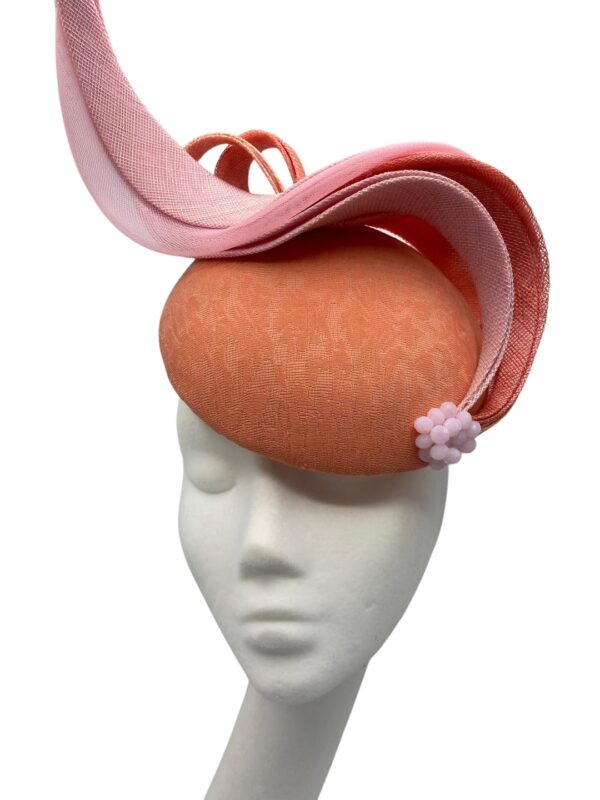 Beautiful pale coral headpiece with baby pink and coral swirl detail.