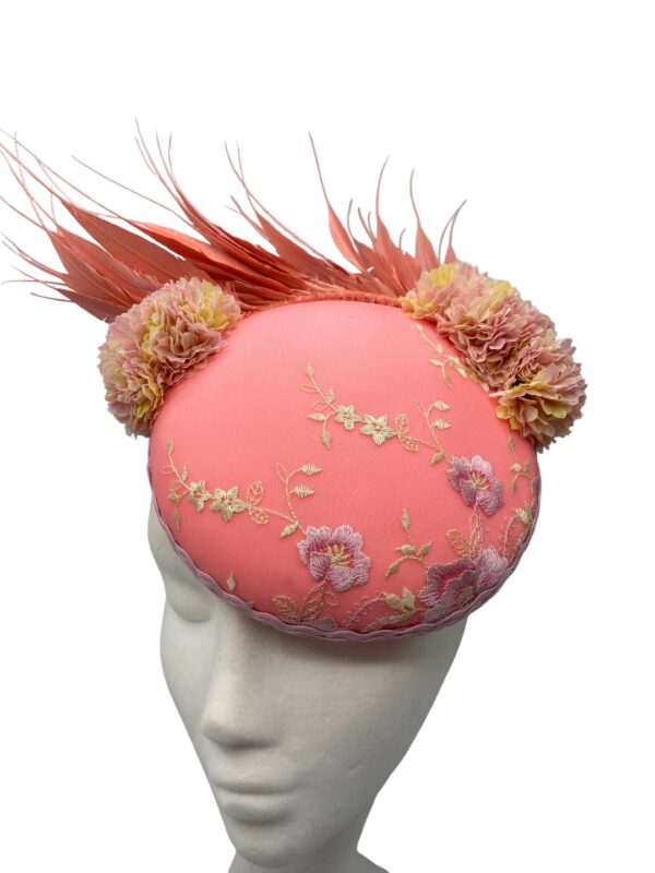 Light coral headpiece with stunning intricate detail to the top.