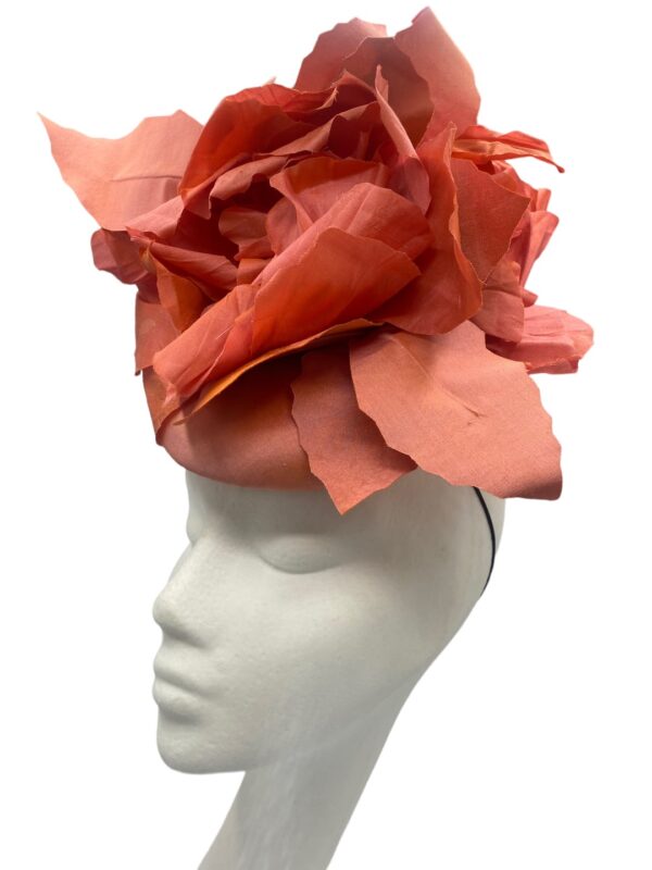 Stunning coral headpiece with individually handmade silk flowers.