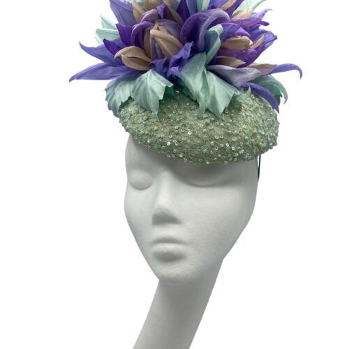 Mint hand beaded headpiece with an array of handmade silk lavender and mint green flowers.