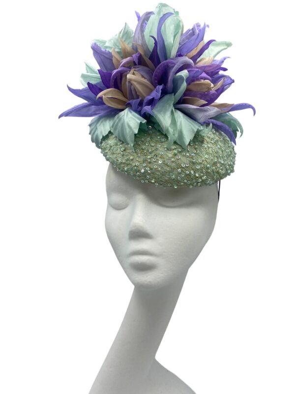 Mint hand beaded headpiece with an array of handmade silk lavender and mint green flowers.