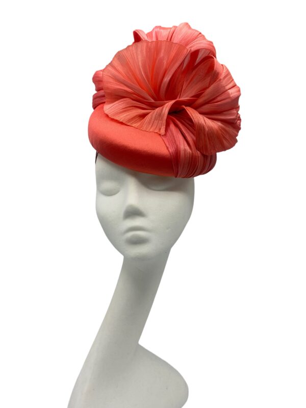 Beautiful coral headpiece with stunning silk abaca detail to the top.