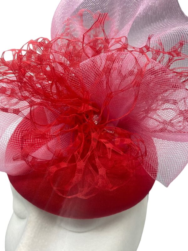 Stunning red headpiece with baby pink crin detail to finish.