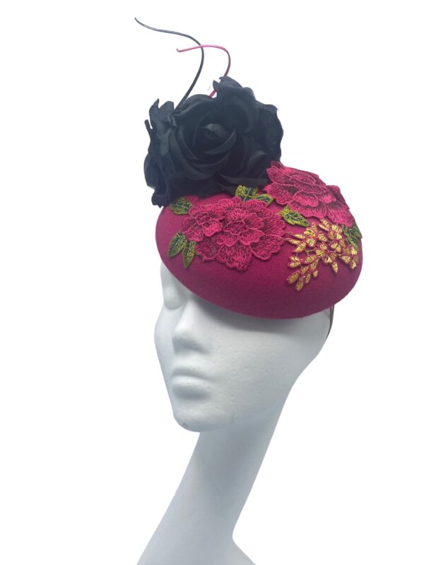 Fuchsia pink headpiece with stunning decorative detail to the base with black flower detail to finish.  