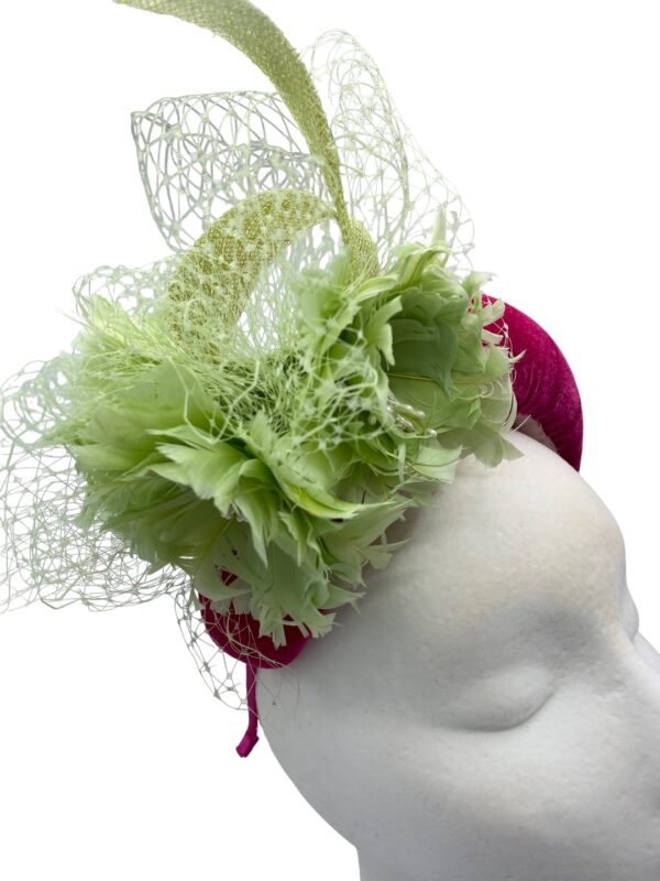 Gorgeous pink bandeau crown with stunning green flower detail.